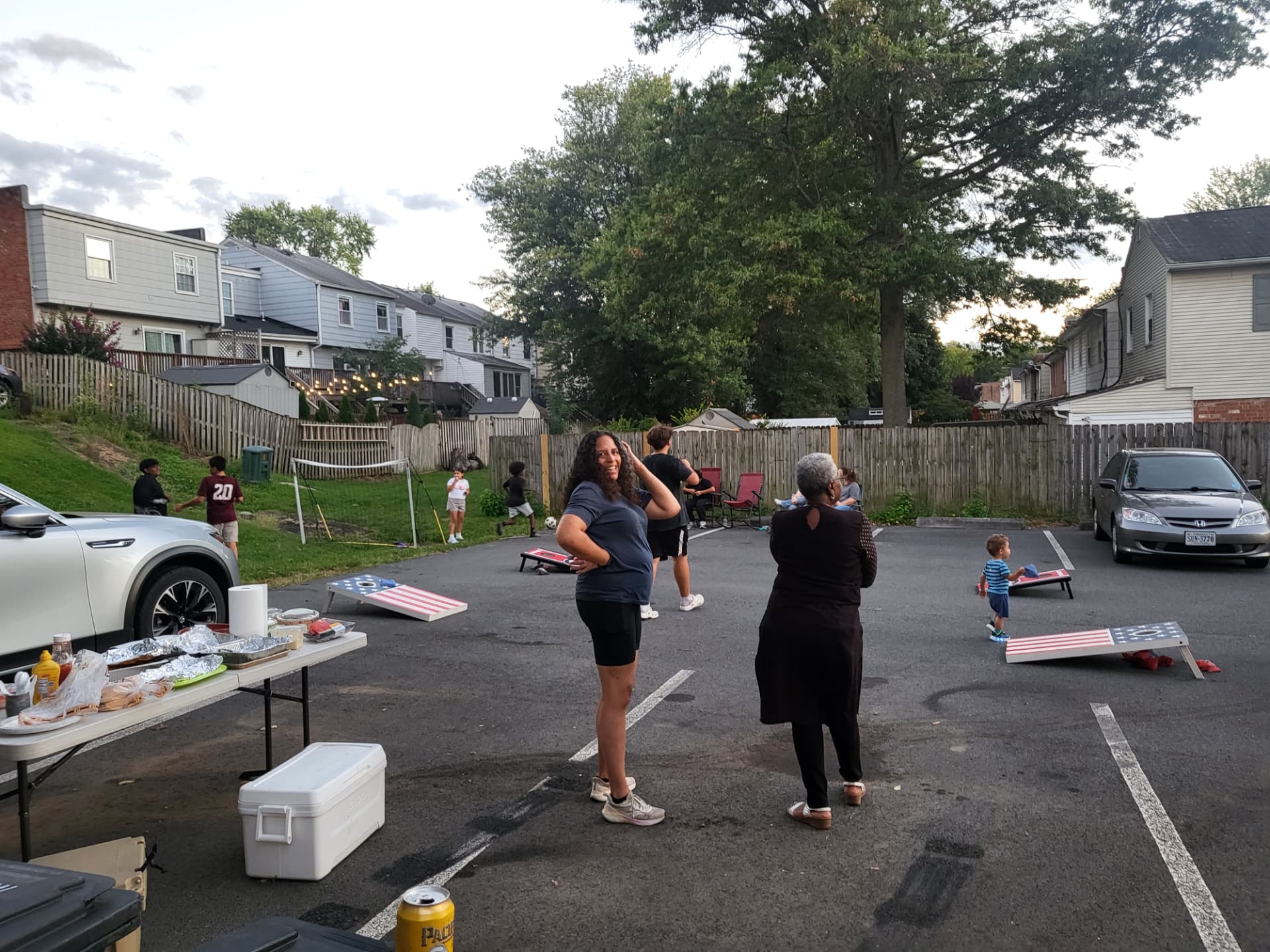 Neighbors gathered in the parking lot for the Labor Day cookout